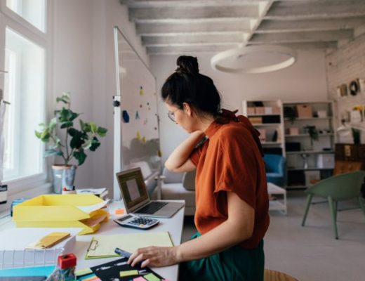 Female independent contractor woman working in a modern office